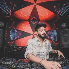 Focused and locked in. Behind the decks is my studio and my stage. Here, I'm reading the crowd, mixing tracks, and delivering the high energy sound I'm known for at a gig in Siliguri.