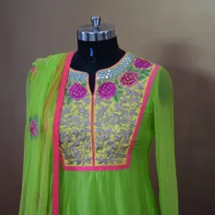 Here is a closer look at the yoke of the neon green Anarkali. You can see the detailed floral threadwork, delicate mirror embellishments, and the contrasting yellow and pink panel that gives it a unique character.