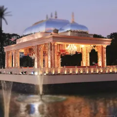 A closer look at the 'Saanjh Niwas' floating mandap at dusk. The reflection on the water and the warm lighting created a truly magical and ethereal atmosphere for the wedding ceremony.