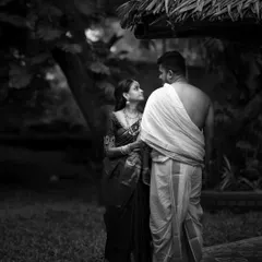 A timeless black and white portrait in a natural setting. By removing color, I can focus purely on the emotion in their shared gaze and the classic beauty of their traditional attire.