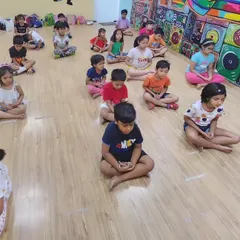 A moment of calm as our youngest students practice simple meditation at the start of their yoga class. Teaching mindfulness early helps build focus and emotional regulation.