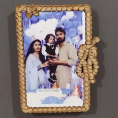 A vertical version of the rope-themed fridge magnet, perfect for portrait photos. This one captures a lovely family moment from a birthday celebration.