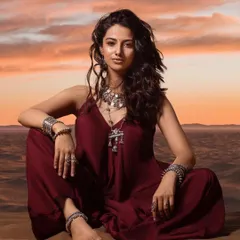 This look captures a bohemian desert vibe. I styled this maroon jumpsuit with heavy silver tribal jewelry to create a story of a modern wanderer against a beautiful sunset.