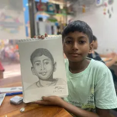 It's an incredible moment of pride for us and our student. This is the result of our portrait sketching course, where this talented 13 year old artist brought his own self portrait to life with pencil and paper.