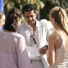 Explaining a piece of magic to a curious group at the Indore wedding. The performance is a conversation, a shared exploration of the impossible.