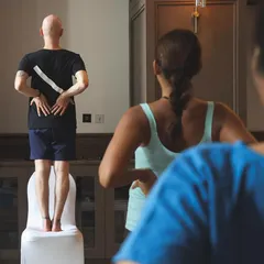 A guest teacher demonstrates a posture during a special workshop. I love collaborating with other experts to bring diverse knowledge and fresh perspectives to the community.