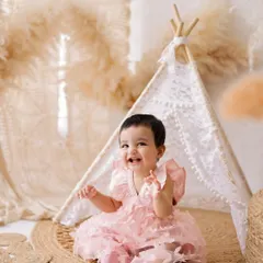 Look at that happy smile! Sitter sessions are perfect for capturing your baby's budding personality as they learn to sit up, laugh, and explore the world.