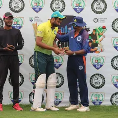 A player receives the Man of the Match award during the post-match presentation of the Sindoor Friendship Cup, a T20 tournament.