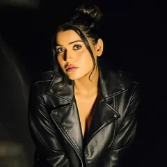 This is an example of a powerful, character-driven look for a fashion portfolio or music video. I used a deep smokey eye and a defined matte lip, paired with a sleek high bun, to create an edgy and confident aesthetic that commands attention.