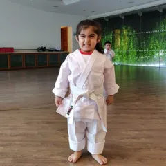 And here is that same little champion with a proud, happy grin after practice. Seeing this kind of confidence grow in a child is the best part of my job.