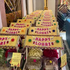 Beautifully crafted Lohri party favors, designed to look like traditional carts and filled with festive treats.