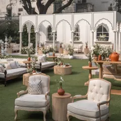 Perfectly uniform and effortlessly elegant, the seating arrangement is a flawless fit for this ivory-themed wedding. I combined classic armchairs with traditional Indian daybeds to create varied and comfortable lounging spaces.