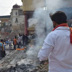 A scene from the Manikarnika Ghat in Banaras during Pitrpaksh. I document these profound rituals of life and death from a distance, capturing the smoke, the crowd, and the solemn atmosphere of moksh.