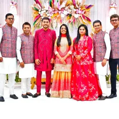 Posing with the talented musicians and the groom's side. We often coordinate our outfits to be a part of the wedding's theme.