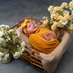 A slightly different angle of this beautiful yellow-themed setup, showing the baby's peaceful expression as she sleeps. I take multiple shots to ensure we capture the perfect moment.