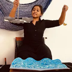 We use all kinds of creative tools to tell our stories. Here, I am using simple paper cutouts and a pop-up book to create a world of waves and clouds during an interactive storytelling session.