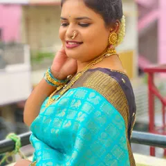 Wrapped in the serenity of blue, this client exudes tranquility and grace. Her makeup is kept soft and natural to complement her beautiful silk saree.