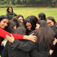 Ubuntu is a core value at Children First, representing our interconnectedness. Here, our team celebrates a colleague's 10-year work anniversary with a group hug, showcasing the warmth and friendship that defines our community.