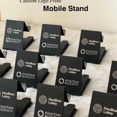Sleek and practical custom mobile stands with logos for Houlihan Lokey and Khaitan & Co. This is a perfect example of a branded giveaway that attendees will use daily.