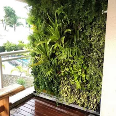 A vertical garden we installed on a residential balcony. This living wall transforms the space into a private green nook, complete with an integrated irrigation system for easy maintenance.