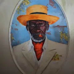 A straight-on shot of the Cuban portrait, showing the incredible detail in the painting and relief work. This piece demonstrates our skill in combining sculpture and painting to create hyper-realistic and impactful characters.