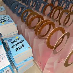 A throwback to a recent Women's Day corporate celebration. We curated hundreds of these gift bags, each containing the book "How Women Rise" and other items.