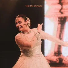 A dancer is captured in a moment of pure joy, with the words "feel the rhythm" overlaid. This is an example of my creative editing style, adding another layer of storytelling to the image.