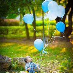 A moment of quiet wonder as this little one watches his balloons float. Outdoor settings provide endless opportunities for beautiful, candid shots.