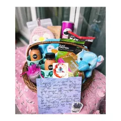 Another view of our family hamper, showing the personal handwritten note included with the collection of shared treats and gifts.