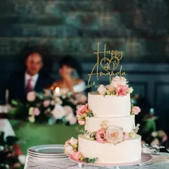 For Amanda's 40th birthday, I designed this elegant three-tiered cake with delicate pink and white roses. The custom gold topper adds a personal touch, making it a perfect centerpiece for a milestone celebration.