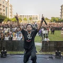 A triumphant moment on stage at KR Mangalam University, connecting with thousands of students. My college fest performances are all about creating unforgettable high energy moments.