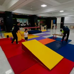 Our new Kandivali East center is a playground for building skills. Here, toddlers navigate a colorful obstacle course with wedges and mats, learning coordination and having fun under the watchful eye of our coaches.