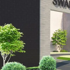 The entrance to Swarnprastha Public School, designed to be modern and welcoming. The combination of dark and light stone cladding creates a bold, clean look for an institution built for tomorrow's leaders.
