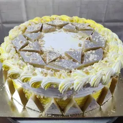 A Kaju Katli cake, another one of my special Indian fusion flavors. The cake is decorated with pieces of the popular cashew fudge.