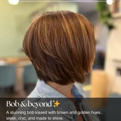 A stunning bob kissed with brown and golden hues. The highlights add dimension and movement to this chic, sleek haircut.