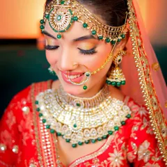 A close-up shot focusing on the detailed bridal makeup and heavy jewelry. I make sure to capture the fine craftsmanship of your wedding look.
