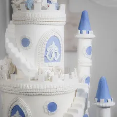 The upper turrets and spiral staircases of the castle cake, showcasing the architectural details I love to create.