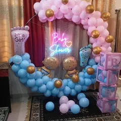Here is a popular gender reveal baby shower theme I designed. It features a circular balloon arch with both pink and blue balloons, a "Baby Shower" neon sign, and matching B-A-B-Y blocks, creating a fun and suspenseful atmosphere for the parents-to-be.
