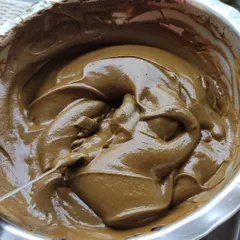 A close look at a freshly mixed bowl of my organic henna paste. The rich, earthy color and glossy sheen come from using pure henna powder and natural essential oils, with no chemicals or artificial dyes added.