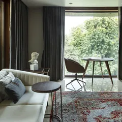 In our Barkat project, we used expansive windows to invite sweeping views of the lush surroundings into every room. The greenery becomes a part of the interior design, blurring the boundaries between the built and natural environments.