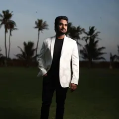 A stylish shot of a client in our white patterned blazer, a perfect complement to a black gown for a pre-wedding shoot.