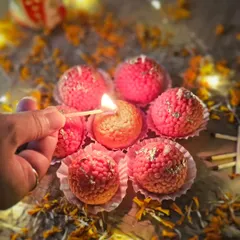 Lighting up one of my iconic Motichoor Ladoo candles. This is the star of my festival ensemble, perfect for illuminating your celebrations and gifting a unique, sweet-smelling treat to loved ones.