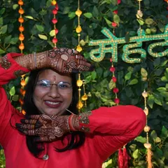 Another pose showing the wonderful stain color against the festive backdrop. My natural henna cones give this consistent, rich result.