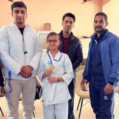 Another one of my students with her gold medal. I stand with every champion I build, guiding them through their journey of hard work and success.