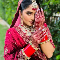 The final look. Here you can see how the deep, rich stain of the mehndi beautifully complements the bride's entire wedding attire, completing her stunning look on the big day.