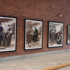 A closer view of four prints from Pushpamala N.'s 'Parimala Prasada' series. This photo-performance work, acquired by the airport, explores themes of female identity and modernity through a vintage aesthetic.