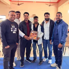 Receiving a memento with my team. Recognition is not the goal, but it is a byproduct of consistent hard work and dedication.