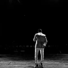 A powerful shot from the stage of a large-scale annual dance event. Hosting for a massive audience in a theater setting is an exhilarating experience.