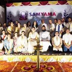 A formal group photo from our Kerala retreat, with everyone seated before the sacred lamp. This picture captures the sense of community and shared purpose we cultivate.