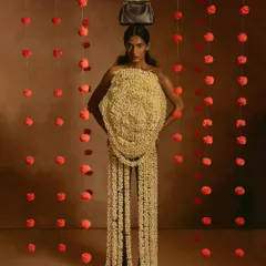 A high-fashion concept where the model wears a dress made entirely of jasmine flowers. This image is a testament to collaborative creativity, blending fashion, art, and photography into a single, stunning visual.